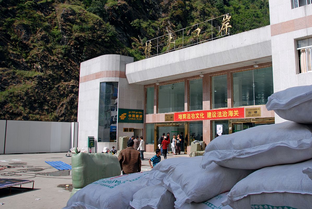 08 China Customs And Immigration Building After Crossing Friendship Bridge From Kodari Nepal After crossing the Friendship Bridge, we meet our Tibetan guide who leads us through China Customs and Immigration.